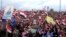 Supporters of Syria's President Bashar al-Assad attend a rally in the northern port city of Tartous, Syria, Jan. 12, 2012.