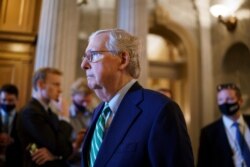 Senate Minority Leader Mitch McConnell, R-Ky., walks past the chamber as the Senate advances to formally begin debate on a roughly $1 trillion infrastructure plan at the Capitol in Washington, July 30, 2021.