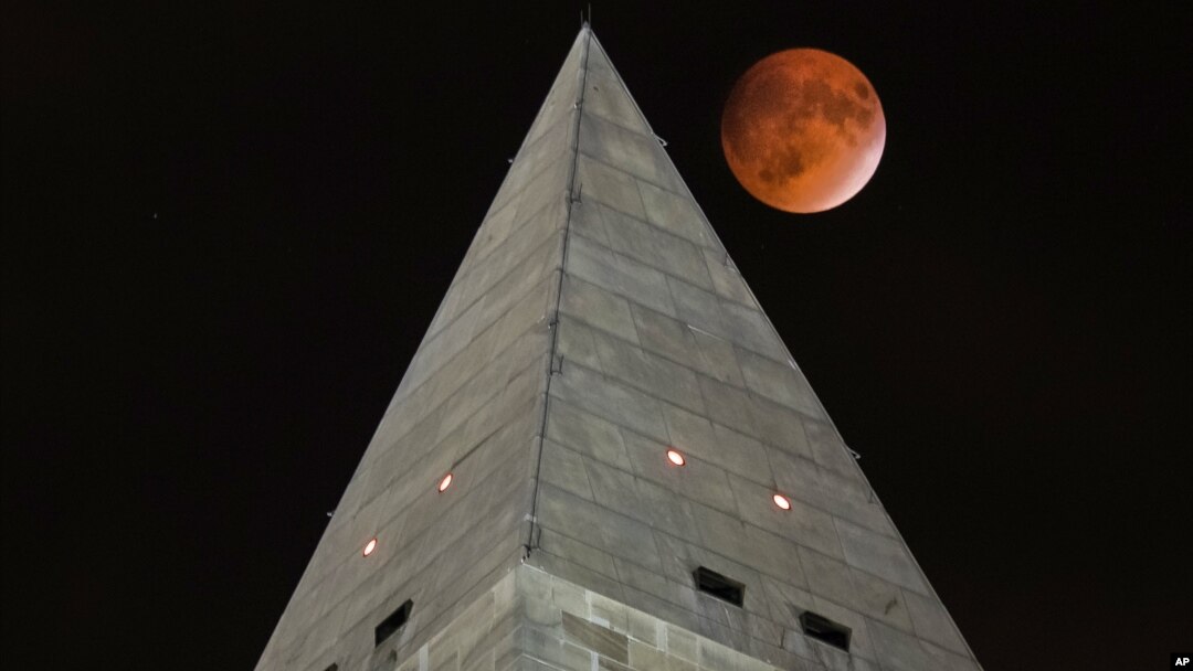 The moon passes behind the peak of the Washington Monument during a lunar eclipse, Sept. 27, 2015. Soon visitors will be able to enjoy the view from the top thanks to philanthropist David Rubenstein, who has pledged the funding needed to fix the monument's elevator, which was forced to shut its doors due to the elevator's mechanical failures. 
