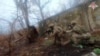 In this photo taken from video released by Russian Defense Ministry Press Service on Dec. 27, 2024, Russian soldiers battle outside Vuhledar, Donbas region, Ukraine. 