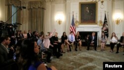 U.S. President Donald Trump hosts a listening session with Marjory Stoneman Douglas High School shooting survivors and students at the White House in Washington, Feb. 21, 2018.