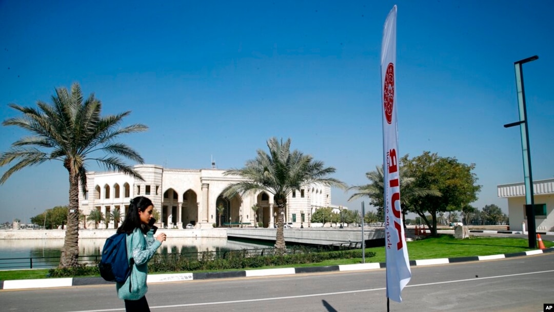 A student walks outside the newly inaugurated American University in Baghdad, Iraq, Feb. 15, 2021. 