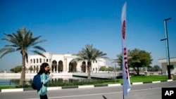 A student walks outside the newly inaugurated American University in Baghdad, Iraq, Feb. 15, 2021. 