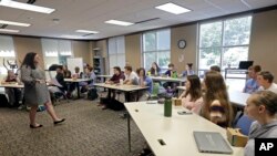 Eleventh-grade students learn about the D-Day invasion at Normandy from social sciences teacher Kasey Turcol during an advanced placement history class at Crossroads FLEX High School in Cary, N.C., May 21, 2019. 