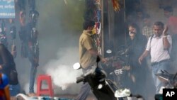 A municipal worker fumigates an area outside a train station to check the spread of mosquito-borne diseases in Mumbai, India, Sept. 3, 2016. The Zika virus has surfaced for the first time in India, with three cases. The patients have recovered.