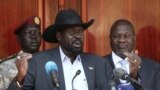 South Sudan President Salva Kiir gives a press conference jointly with his former vice-president and political rival Riek Machar, right, after they met at the State House in Juba, Feb. 20, 2020.