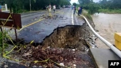 This handout photo released by the Honduran Presidency shows a damaged road after the passage of Hurricane Iota in El Florido, Honduras, on the border with Guatemala, on Nov. 18, 2020.
