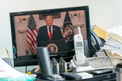 U.S. President Donald Trump is seen on a video screen remotely addressing the 75th session of the United Nations General Assembly, at U.N. headquarters, Sept. 22, 2020.