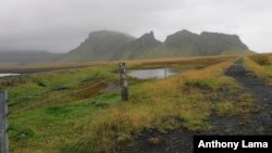 FILE - Iceland's desolate landscape stretches beyond Vik, a small town of just 300 people, towards the Katla volcano, unseen,which last erupted in 1918, in this Sept. 27, 2011 photo. 