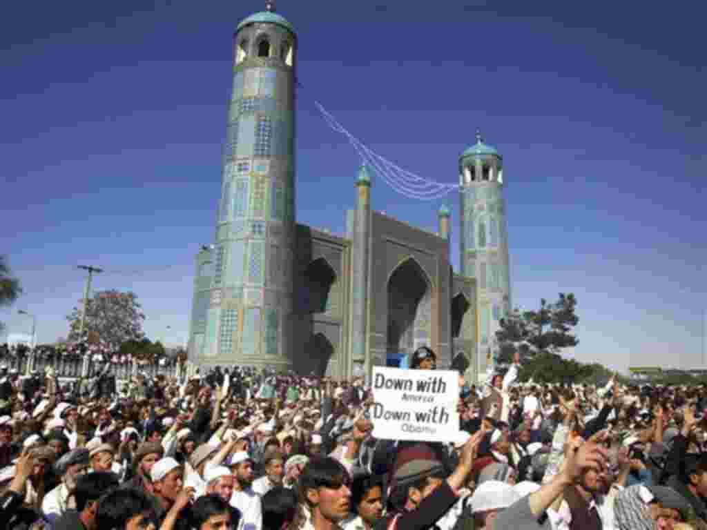 Afghans chant anti US slogans during a demonstration in Mazar-i- Sharif north of Kabul, Afghanistan on Friday, April. 1, 2011. Eight foreigners were killed on Friday after demonstrators protesting a reported burning of the Muslim holy book stormed a Un