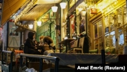 Customers, at a small cafe, listen to the traditional love song Sevdalinka, in Sarajevo, Bosnia and Herzegovina, December 27, 2024. (REUTERS/Amel Emric)