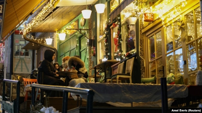 Customers, at a small cafe, listen to the traditional love song Sevdalinka, in Sarajevo, Bosnia and Herzegovina, December 27, 2024. (REUTERS/Amel Emric)