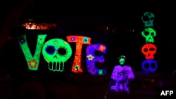 Halloween decorations urging people to vote in the upcoming presidential election are displayed in front of a home on Oct. 30, 2020, in Sierra Madre, California.