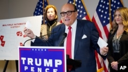 FILE - Former Mayor of New York Rudy Giuliani, a lawyer for President Donald Trump, speaks during a news conference at the Republican National Committee headquarters, in Washington, Nov. 19, 2020.