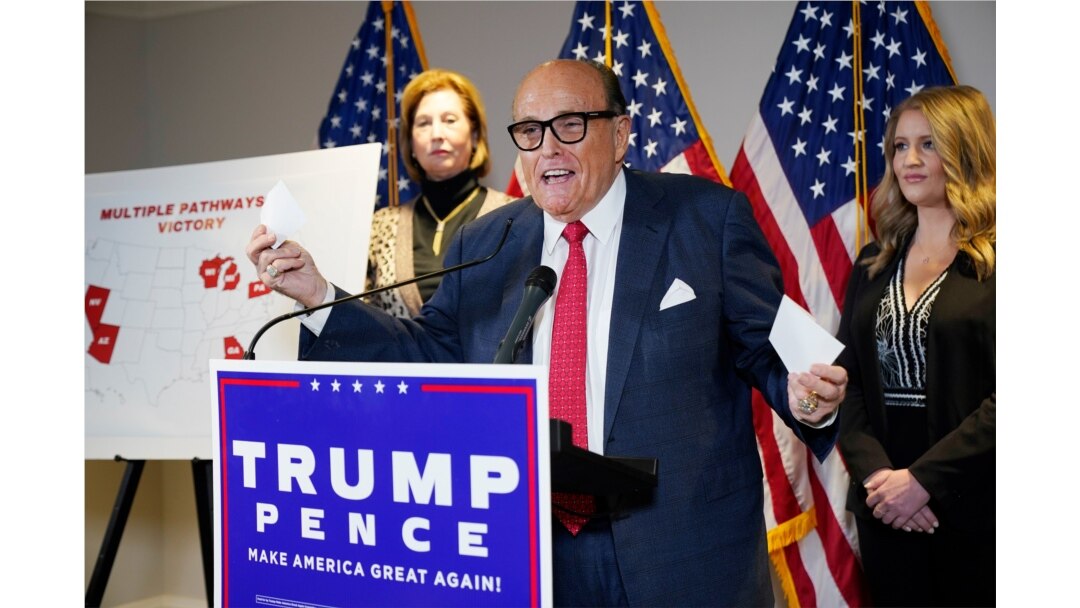 FILE - Former Mayor of New York Rudy Giuliani, a lawyer for President Donald Trump, speaks during a news conference at the Republican National Committee headquarters, November 19, 2020, in Washington.