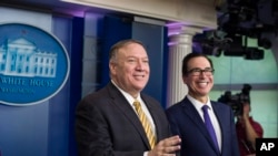 Secretary of State Mike Pompeo and Treasury Secretary Steve Mnuchin laugh as they speak with reporters in the White House, Sept. 10, 2019, in Washington. National Security Adviser John Bolton was to have attended, but the president announced his leaving. 
