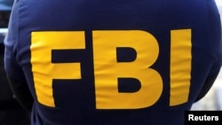 FILE PHOTO: An FBI logo is pictured on an agent's shirt in Manhattan