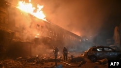 Rescuers of the State Emergency Service work to extinguish a fire in a building after a drone strike in Kharkiv, on Jan. 28, 2025, amid the Russian invasion in Ukraine.