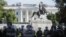 Washington, D.C., National Guard military police officers stand guard as demonstrators rally near the White House in Washington, June 1, 2020, against the death in Minneapolis police custody of George Floyd. 