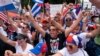 With the White House in the background, hundreds of people, many of Cuban descent, protest the Cuban government, July 26, 2021, at Lafayette Park in Washington.