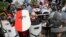 White nationalist demonstrators use shields as they guard the entrance to Lee Park in Charlottesville, Va., Aug. 12, 2017. 