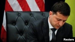 Ukraine's President Volodymyr Zelenskiy listens during a bilateral meeting with U.S. President Donald Trump on the sidelines of the 74th session of the United Nations General Assembly in New York, Sept. 25, 2019. 