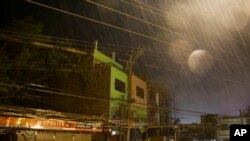 Strong winds and rain batter buildings and business establishments as Typhoon Mangkhut hits Tuguegarao city, Cagayan province, northeastern Philippines, Sept. 15, 2018. Typhoon Mangkhut slammed into the country's northeastern coast early Saturday.