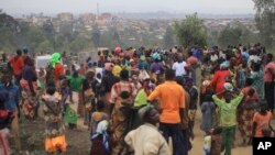 FILE - People who fled from their homes following recently attacks by assailants take refuge at a camp for displaced people in Bunia, Eastern Congo, Feb. 17, 2018.