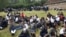 Students sit at the St. George's Girls' Secondary School as they wait to be picked up after learning classes were called off due to the spreading of the COVID-19 coronavirus, in Nairobi on March 17, 2020.
