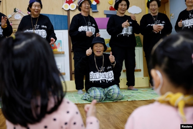 Park Jeom-sun, 81, the leader of the granny rap group "Suni and Seven Princesses", and the members rap in front of young children at a daycare center in Chilgok, South Korea, February 6, 2024. (REUTERS/Kim Soo-hyeon)