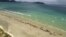 FILE - Pilot whales lie beached at Mason Bay, Rakiura, on Stewart Island, New Zealand, Nov. 25, 2018.