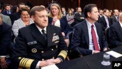 FILE - National Security Agency Director Admiral Michael Rogers (L) and FBI Director James Comey, testify before a congressional panel on Capitol Hill in Washington, Feb. 9, 2016. On Monday, lawmakers will question Rogers and Comey on allegations of Russia’s meddling in the 2016 presidential election and President Donald Trump’s claim that president Barack Obama had his phones tapped during the campaign.