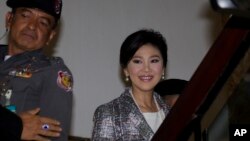 Thailand's former Prime Minister Yingluck Shinawatra, arrives at parliament in Bangkok, Thailand Thursday, Jan. 22, 2015.