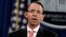 FILE - Deputy Attorney General Rod Rosenstein speaks during a news conference at the Department of Justice, July 13 2018. Rosenstein is defending the prosecution of foreign agents who may never see the inside of a U.S. courtroom.