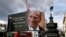 A tribute to Britain's Prince Philip is projected onto a large screen at Piccadilly Circus in London, after the announcement of the duke's death.