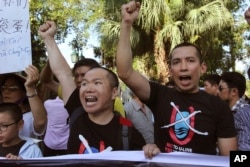 FILE - Vientnamese protesters chant anti-China slogans in Hanoi, Vietnam Thursday, June 19, 2014.