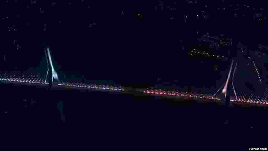 Daraja la Mto Nile likiwa katika masafa ya mbali.