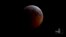 FILE - This image from video provided by Griffith Observatory in Los Angeles shows an impact flash on the moon (Bottom-L) during the lunar eclipse which started on Jan. 20, 2019. 