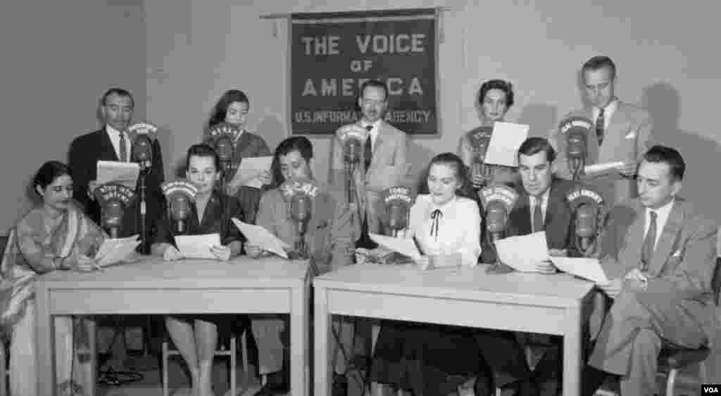 A group shot of VOA broadcasters. VOA used to be part of the "U.S. Information Agency."