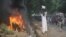 A Sudanese protester stands on a barricade during a demonstration in Khartoum, September 14, 2012, as part of widespread anger across the Muslim world about a film ridiculing Islam's Prophet Muhammad. 
