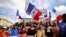 Protesters attend a demonstration called by the French nationalist party "Les Patriotes" against restrictions, including a compulsory health pass, to fight COVID-19, outside the Ministry of Health in Paris, France, July 31, 2021.