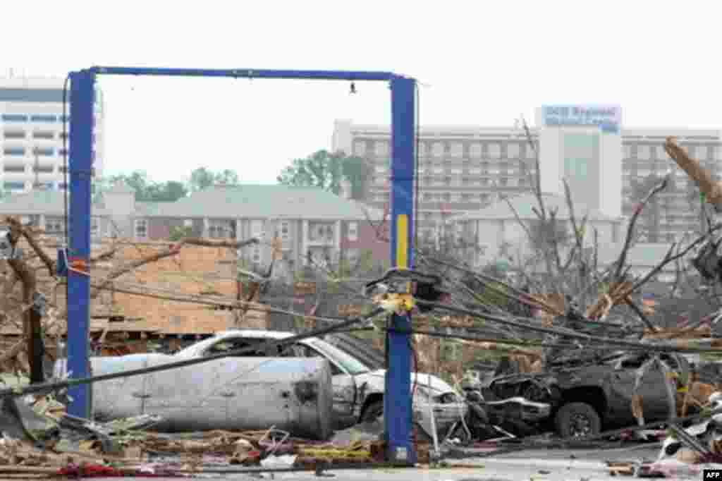 Debris is littered after a tornado hit, Wednesday, April 27, 2011 Tuscaloosa, Ala. A wave of severe storms laced with tornadoes strafed the South on Wednesday, killing at least 16 people around the region and splintering buildings across swaths of an Alab