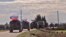 An image grab taken from AFP TV, Jan. 17, 2019, shows Russian army vehicles on patrol in the area of Arimah, just west of Manbij, the northern city near the Turkish border where a day earlier a suicide attack on a restaurant killed four Americans. 