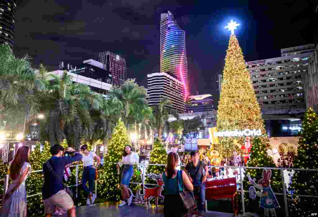 People enjoy the holiday season lights in downtown Bangkok.