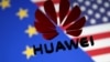 FILE — A 3D printed Huawei logo is placed on glass above a display of EU and US flags in this illustration taken Jan. 29, 2019. 