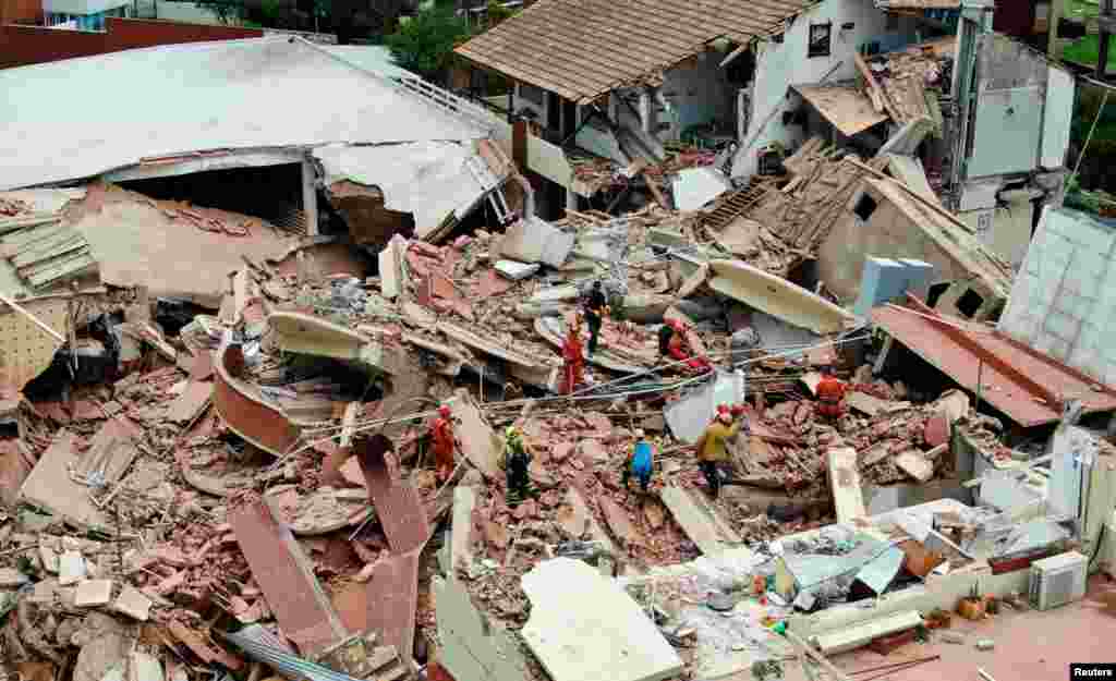 A drone view shows rescue workers searching for victims amidst the remains of the hotel Dubrovnik, after it collapsed, in the coastal city of Villa Gesell, Buenos Aires, Argentina.