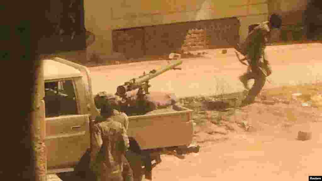 A military vehicle and soldiers said to be from the Sudanese armed forces are seen on a street in Khartoum, Sudan. (Reuters)