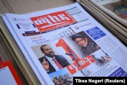Ethiopia’s Prime Minister Abiy Ahmed and leader of the Tigray People's Liberation Front (TPLF) party Debretsion Gebremichael are pictured on the Maleda Local News papers, showing the conflict marking one year, in Addis Ababa, Ethiopia, November 3, 2021