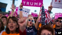 Supporters of Republican presidential candidate Donald Trump cheer during a campaign rally, Oct. 24, 2016, in Tampa, Fla. 