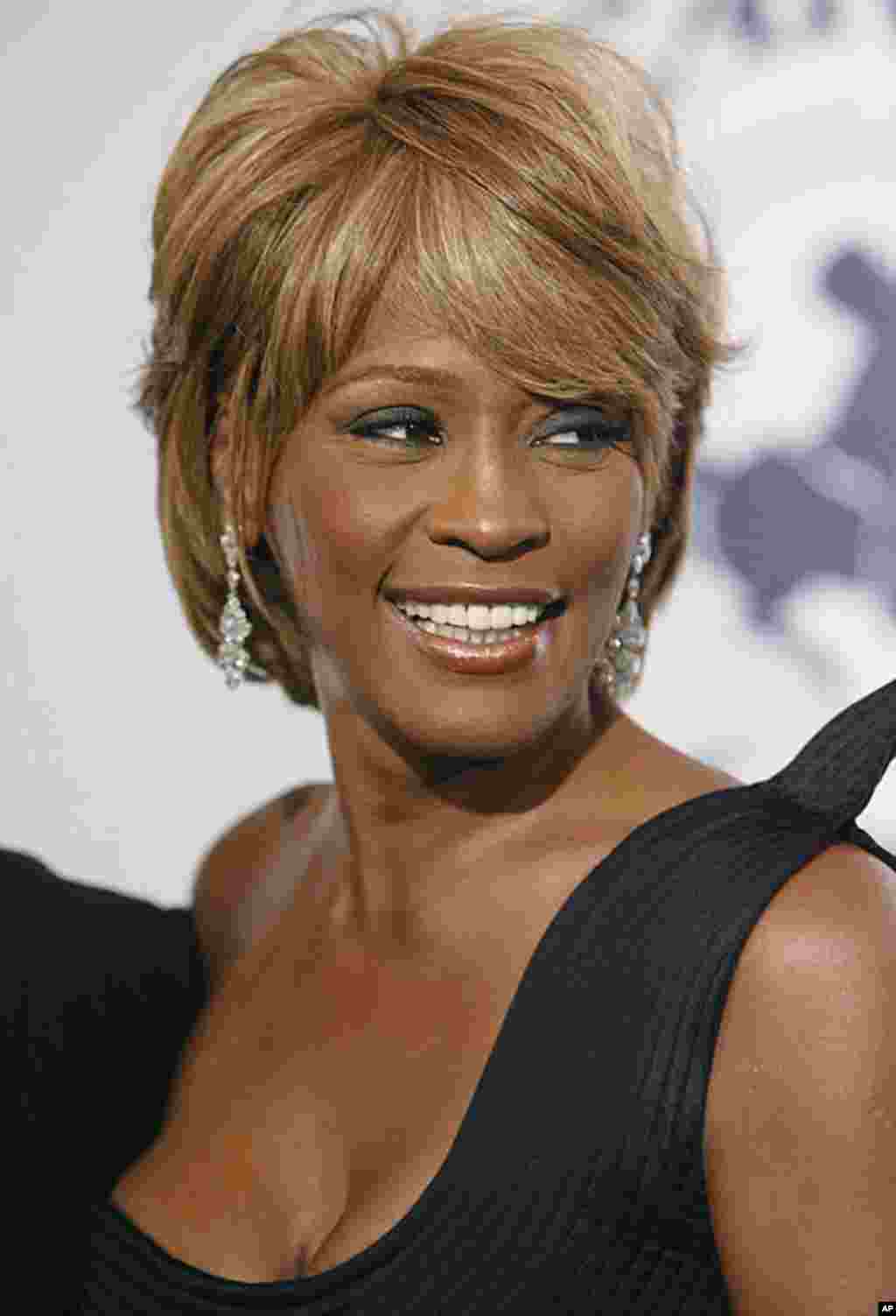 In this Oct.ober 28, 2006 photo, Whitney Houston arrives at the 17th Carousel of Hope Ball in Beverly Hills, California. Houston died February 11, 2012. (AP)